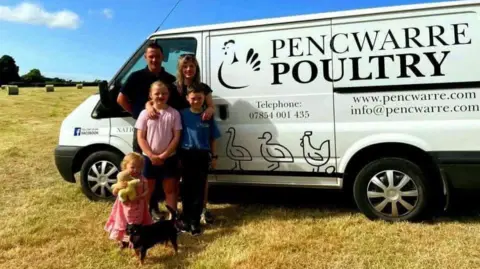 Pencwarre Poultry Chris Thomas and his family of Pencwarre Poultry standing in a field and in front of a white van with the business' branding on it.
