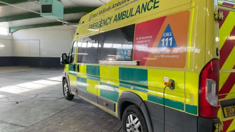 BBC Ambulance stationary in an under-cover car park