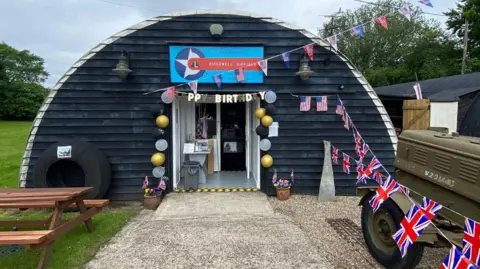  Ridgewell Airfield Essex Gliding Club’s with happy birthday and union jack bunting 