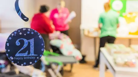 Tom Hibberd Photography A 21st rosette with a blurred image behind