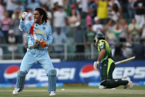 Getty Images - SEPTEMBER 24: MS Dhoni of India celebrates his team's victory with Misbah-ul-Haq of Pakistan looking on during the Twenty20 Championship Final match between Pakistan and India at The Wanderers Stadium on September 24, 2007 in Johannesburg, South Africa