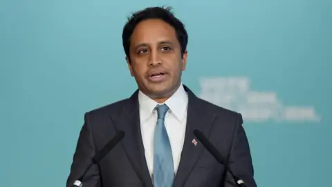 Zia Yusuf speaks during a press conference in Westminster