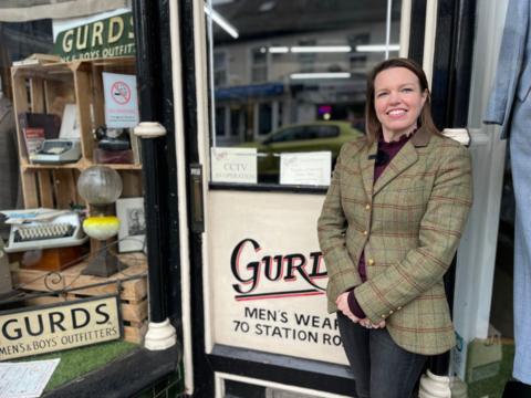 Sarah Farnfield standing outside of the Gurds store