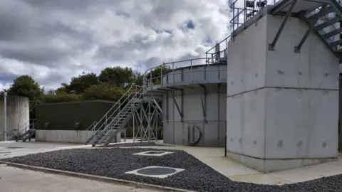 Northumbrian Water Kelloe Sewage Treatment Works. Metal steps lead up to a new tank.