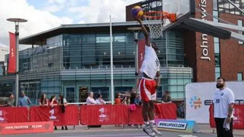 Merseyside Police and Crime Commissioner A basketball player about to score a basket through the basketball hoop located at Liverpool One 