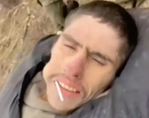 jeka___af/TikTok  Oleksii's being rescued - helium  has a lollipop successful  his mouth