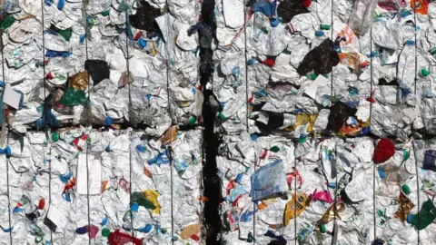 Reuters Compressed plastic waste at a recycling plant