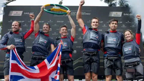 The British team celebrate SailGP victory in Sydney