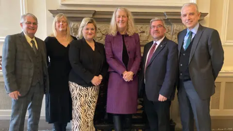 Left to right: Hans Mundry (leader, Warrington Borough Council), Jean Flaherty (deputy leader, Warrington Borough Council), Karen Shore (deputy leader Cheshire West and Chester Council), Louise Gittins (leader, Cheshire West and Chester Council), Nick Mannion (leader, Cheshire East Council) and Michael Gorman (deputy, leader Cheshire East Council)