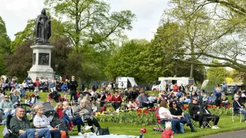 Stuart Walker photography A park full of people sitting in deckchairs 