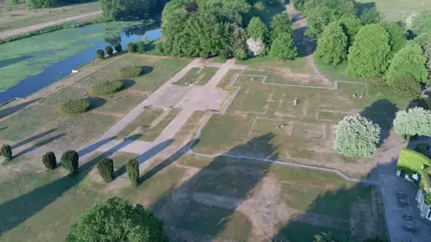 National Trust A drone shot of outlines in the parched grass