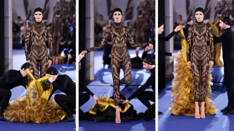 Benjamin Cremel/Getty Images A model walks the runway during the Alexis Mabille Haute Couture Fall/Winter 2026/2027 show as part of Paris Fashion Week on July 07, 2026 in Paris, France.