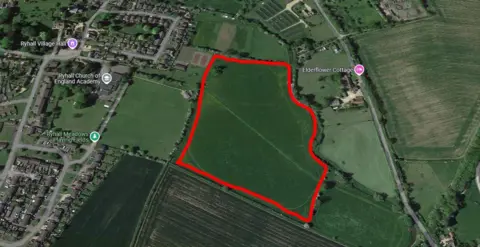 A piece of green space outlined in red where the village green would be in Ryhall, Rutland.