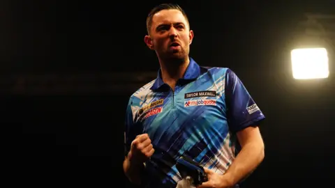 Luke Humphries celebrates following victory during night fifteen of the 2026 Premier League Darts at the Utilita Arena, Birmingham