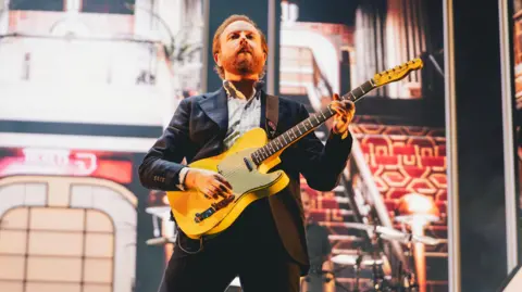 Luke Brennan/Getty Images Alex Trimble, lead vocalist of Two Door Cinema Club, performs during the 2026 Y Not Festival at Pikehall 