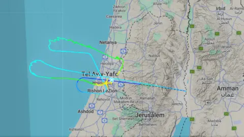 FlightRadar24 The flightpath of a US Air Force air-to-air refuelling tanker shown on a map, as it took off from Tel Aviv, Israel, turned off its transponder heading east towards Iran, and then returned to base. 
