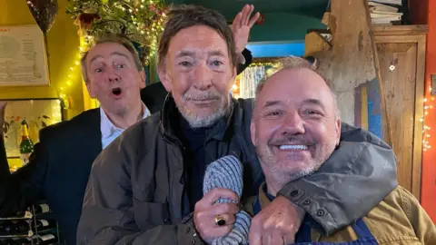 Mortimer and Whitehouse: Gone Fishing Paul Whitehouse, Chris Rea and Bob Mortimer pose for a photo in a pub. 