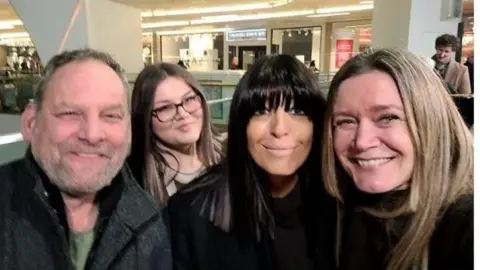 Cambridge University Hospitals Grace Matthews at the piano with, in the foreground, dad Brian, mum Vicky, and Claudia Winkleman.