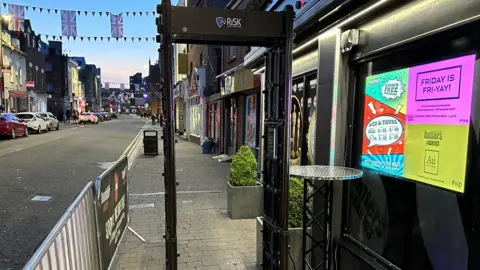 Gloucester BID A walk-through knife detector placed outside of a nightclub