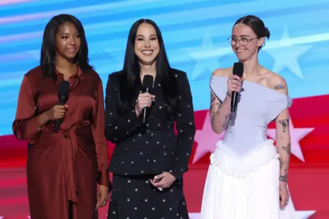 Reuters Helena Hudlin, Meena Harris, and Ella Emhoff take the stage at the Democratic National Convention in Chicago.