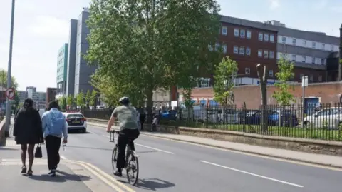 Leeds City Council Cyclist using the road along Beckett Street