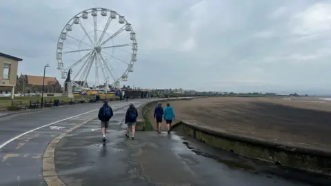 Beach with just four people on it