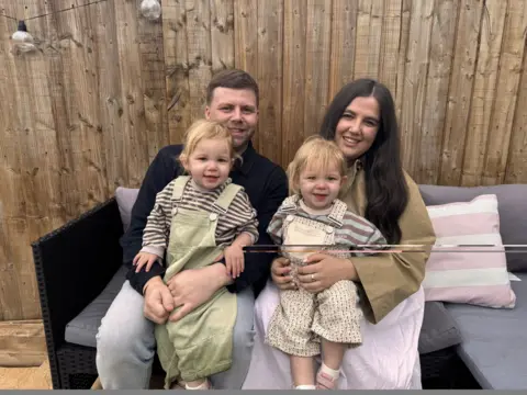 Parents with their twins