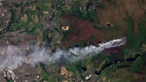 Planet Labs PBC Satellite image showing smoke plume drifting west