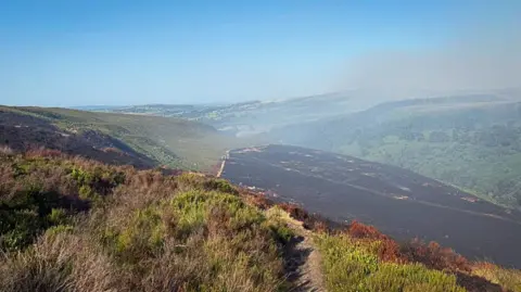 Derby Mountain Rescue Team Smoke rises above the moors.