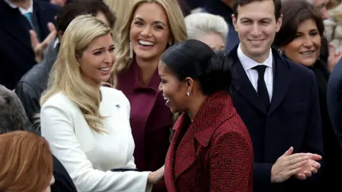 Getty Images Ivanka Trump speaking with Michelle Obama while Vanessa Trump and Jared Kushner look on, smiling.