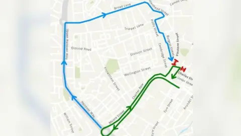 Sheffield City Council A street map of Sheffield city centre with roads shown as white on a grey backround. One diversion route is highlighted in blue, the other is shown in green. Two small sections are highlighted in red to represent the areas where the roads are closed.