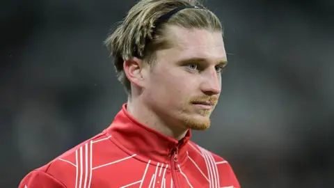 Close up of Dennis Cirkin with red Sunderland training jacket visible to shoulders