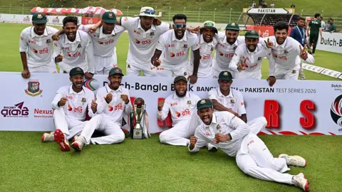 Bangladesh celebrate with the Test trophy