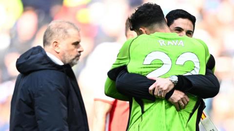Arsenal boss Mikel Arteta hugs David Raya after their win over Tottenham in the Premier League