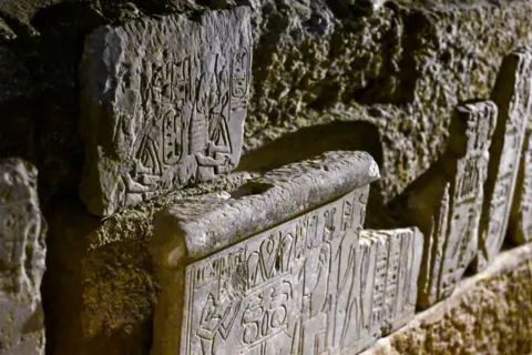 Khaled Desouki / AFP A picture shows a newly-unearthed carved relief during a media event to announce new discoveries by an Egyptian archaeological mission at Queen Hatshepsut's Valley Temple in Deir El-Bahari on the Nile's west bank in Luxor - Wednesday 8 January 2025. 