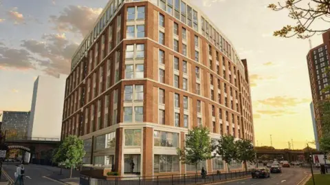 A computer‑generated visualisation of a proposed block of flats on a street corner. At the centre is a large, curved, mid‑rise block built out of red bricks, with evenly spaced vertical windows across each floor. The development sits alongside a road junction with pavements, railings and street furniture.