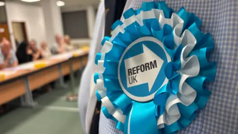 A Reform UK rosette
