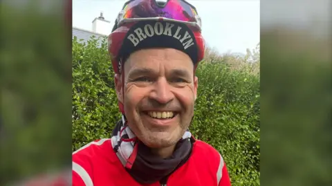 David Hogg A smiling man in cycling gear