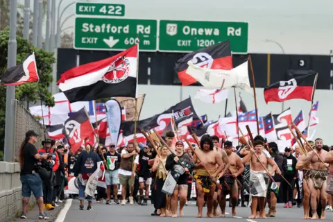 Getty Images Hikoi members walk across the Auckland Harbour Bridge on day three of a nine-day journey to Wellington on November 13, 2024 in Auckland, New Zealand. 