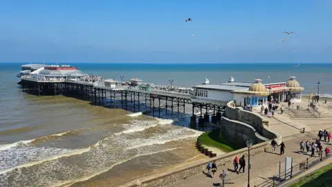 Cromer Pier, as seen from the an elevated position above the promenade.