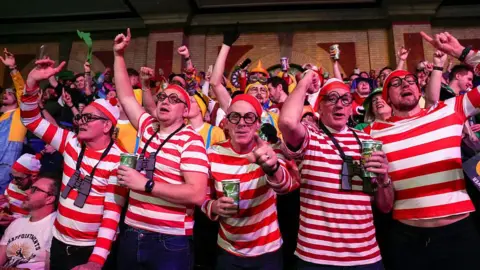 Getty Images Fans dressed as Where's Wally at the World Darts Championships at the Alexandra Palace in London.