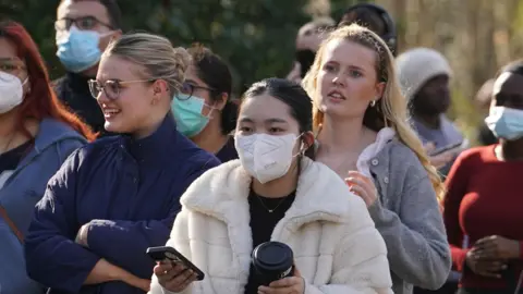 PA Media A group of students wearing protective masks. 