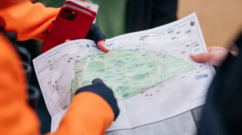 The Royal Parks A map of Richmond Park in the hands of a volunteer ranger