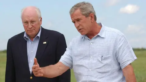 Getty Images President George W Bush, along with Vice President Dick Cheney, answers a question during a press conference at his ranch in Crawford, Texas, in August 2004.