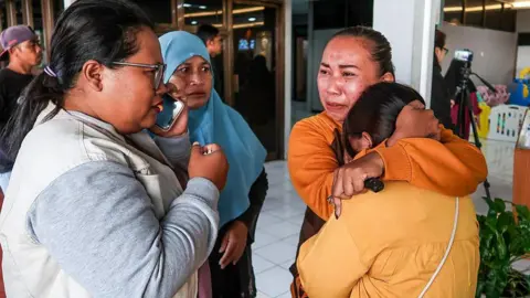 Woman hugging each other and crying