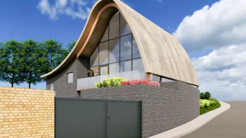 A proposed design of the hospital shows a grey two-storey building with a curved roof and a balcony. The first floor is mostly made of glass. The building is behind a fence. There are two people standing on the balcony.