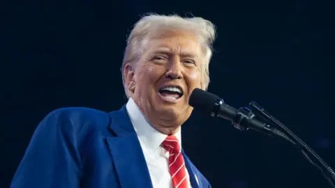 Getty Images Donald Trump speaks at a Turning Point conference in Arizona.