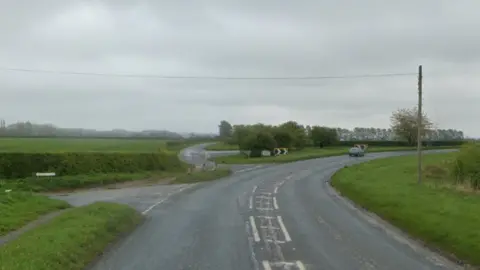 The A170 road at Nawton, with two exits to the left and a sharp bend to the right