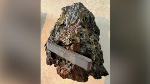 Jill Gaff A rock with different colours on it.