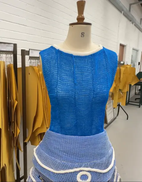 Heriot-Watt University A blue tank-top and blue skirt with white embroidery on a mannequin